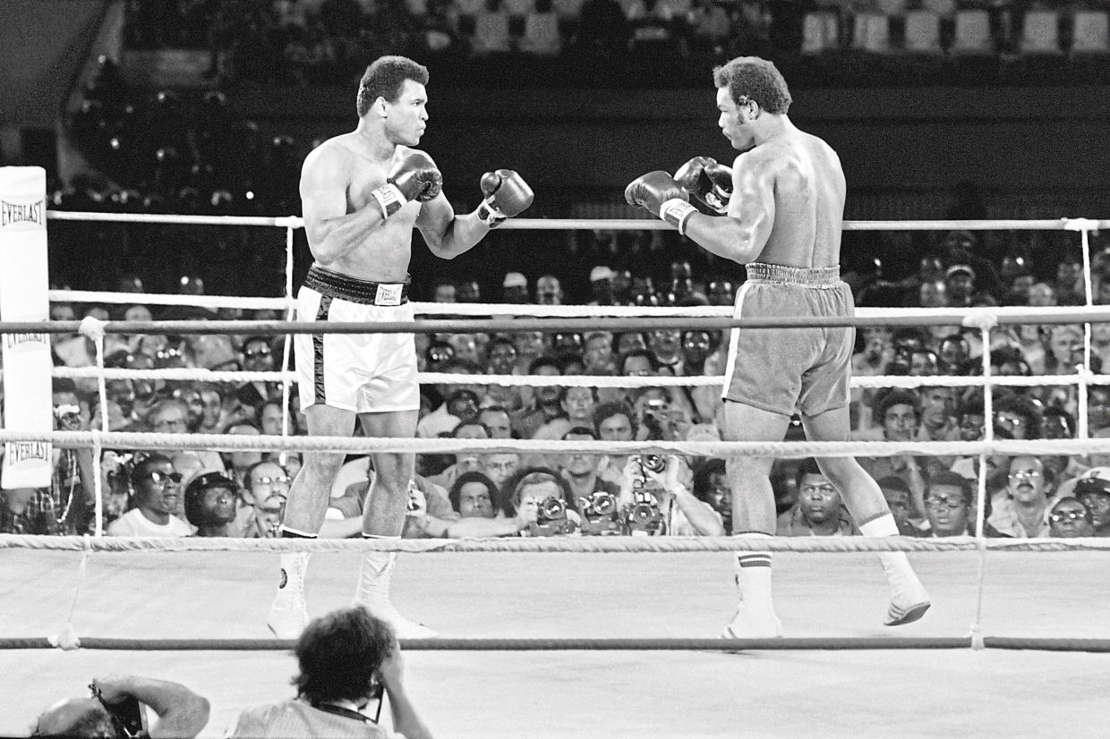 This photo taken on Oct 30, 1974, shows the classic fight (billed as Rumble in the Jungle) between American boxing heavyweight champions Muhammad Ali (left) and George Foreman in Kinshasa, Zaire (now the Democratic Republic of the Congo). Both the late athletes were Capricorns. — AFP Filepic